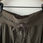 Lululemon Dance Studio Crop *25" in Dark Olive Stretch Cropped Pockets Athletic Photo 11