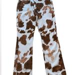 We Wore What  Brown and White Cowhide Pattern Bootcut Jeans Photo 0