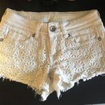 Dollhouse Crocheted floral jean shorts Photo 0