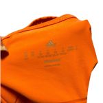 Adidas Stay stylish and comfortable with the  Women's Orange Tank Top. Perfect for workouts or casual wear, this top offers a vibrant look and a great fit. Photo 5