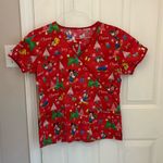 Disney Christmas Print Women’s Scrub Top in Red Photo 6