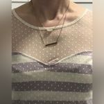 White and light purple shirt Photo 2