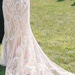 Allure Bridal  Wedding Dress Style; F239 Andi Was altered to fit me at 5’2. The dress does have a few small tears in the train which are pictured. A bustle was added to the dress the train can be tied up. Any extra fabric from being altered was also saved. Photo 0