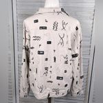 Chico's Stretchy Jean Jacket Snap Front Tan w Black Cave Drawing Design-3/Large Photo 1