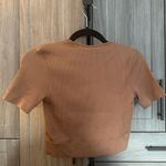 Puma ‘Dare To’ Cropped Tee with Cut Out Short Sleeves in Mushroom Brown Photo 5