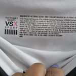 Victoria's Secret VSX sport knockout tight leggings in black, white and pink size medium. Photo 5