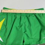 Nike  Women’s Size Large Green and Yellow Lightweight Performance Shorts Photo 5