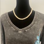 Central Park West Women's Black Long Sleeve Top with Blue Design Photo 2