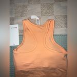 Lululemon NWT  Ebb to Street Cropped Racerback Tank
Size 4
Peach Bellini Photo 4