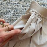 Nike NWT-  24.7 PerfectStretch
Women's Dri-FIT High-Waisted Loose Pleated Shorts Photo 5