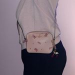 Coach Blush Crossbody Bag with Butterfly Accents Photo 1
