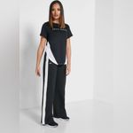 Under Armour | Athlete Recovery Wide Leg Snap Pants Black Pants White Accents Photo 2