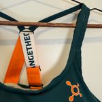 Orangetheory Teal Sports Bra with Orange Accents Photo 1