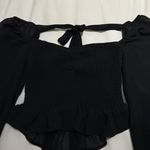 Gab & Kate Mixology  Black Sheer Smocked Ruffle Long Sleeve Tie Back Photo 1