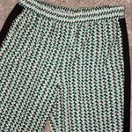 BCBGMAXAZRIA 2 pocket pant in sea green and coral print with black side stripe Photo 1