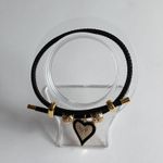 Adjustable steel wire bracelet with charm. Gold Photo 5