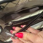 Dooney & Bourke Black and Cream Logo Satchel with blue duck bag charm Photo 6