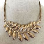 ALDO  gold tone feather leaf pendant necklace Photo 9