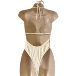 Plunge halter neck thong one piece swimsuit with metal shell medallion cream ivo Photo 2