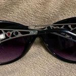 Black sunglasses with red, white, and black design Photo 2