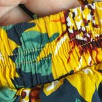 Brandy Melville Brady Melville flowy sunflower floral pleated skater skirt with elastic waist Photo 1