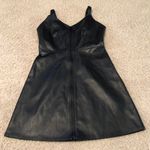 Urban Outfitters Faux leather zip down black dress never worn Photo 1