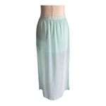 Divided H&M -MAXI SKIRT-SIZE 4 Gorgeous mint green skirt, mini skirt with a sheer maxi overlay, elastic waist, slits on both sides of the skirt, excellent condition Measurements: Waist: side to side 13-17 inches Length: mini skirt Waistband to bottom 13 inches Length: overlay skirt Waistband to bottom 41 1/2 inches Photo 4