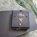 Coach  Gold Tone Studded Bow Slider Bracelet Photo 0