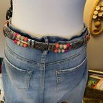Silver tone concho style belt with pink & cream wooden beads. Photo 3