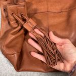 Hobo International HOBO Women's Leather Shoulder Bag with Tassel Accents Zip-Top Closure Photo 2