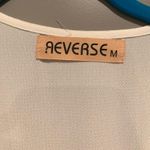 Reverse White Cutout Romper Photo 4