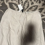 Divided H & m  crop pants. Size medium. NWT. Khaki and white striped. Pockets. Photo 1