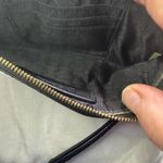 Michael Kors  Womens Saffiano Leather Stud Long Zip Clutch with gold tone studs. Photo 5