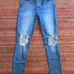 Levi's 721 HIGH RISE SKINNY RIPPED KNEE JEANS Photo 0