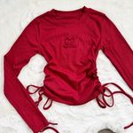 Dazy Red long sleeve top with heart cutout and ruching Size XS Photo 1