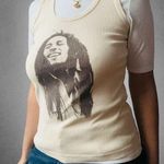 Zion Rootswear β
Bob Marley TankTop - Cream β
Photo 0