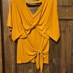 Daytrip  open back top. Photo 1