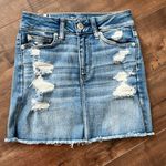 American Eagle AEO Next Level Medium Wash Distressed Ripped Jean Skirt Size 0 Photo 4