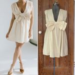 BUCKET LIST Darcy Cream Big Bow Deep V Babydoll Coquette Mini Dress Photo 1