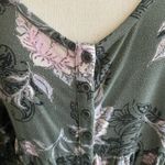 Torrid -WOMENS SIZE 1X-GREEN FLORAL BABYDOLL TOP Super soft knit, button front, super stretchy, 3/4 sleeves, great condition Measurements: Bust: armpit to armpit 24 inches Length: shoulder seam to bottom Front 29 inches Back. 32 inches Photo 1