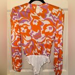 Skylar Rose Vibrant Floral Bodysuit in Orange and Purple Photo 1