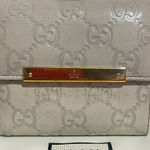 Gucci  Embossed  Leather Compact Wallet Photo 0
