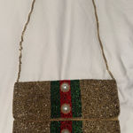 Elegant Gold Beaded Clutch with Chain Strap Photo 0
