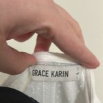 Grace Karin  White Peplum Eyelet Wrap Top Photo 1