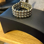 Bracelet, silver tone it looks like a belt buckle. The belt buckle has bling Photo 1