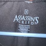 Assassin's Creed T Shirt Womens Small Black Short Sleeve “We Can Do It” Photo 1