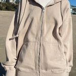 Brandy Melville tan oversized Christy hoodie Photo 0