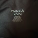 woman’s shiny black with Reebok on leg silver Leggings yoga workout Photo 6