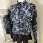 Spyder Black and White Running Jacket with layered Athletic Silhouette Photo 11