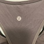Lululemon Athletica! Black muscle tank top with a built in sports bra size 6! Photo 2